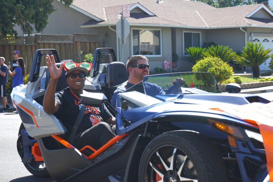 New principal Demetrius Ball waves to the crowd during Cal’s annual homecoming parade.