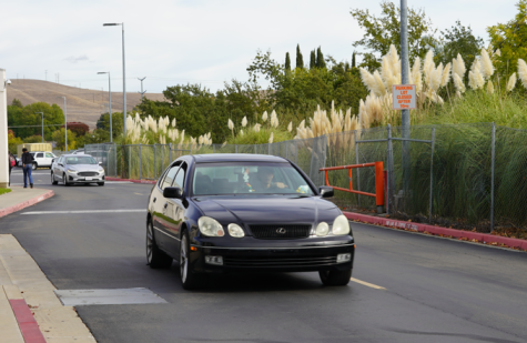 A Cal High student exits the back parking lot in their car onto the traffic route.