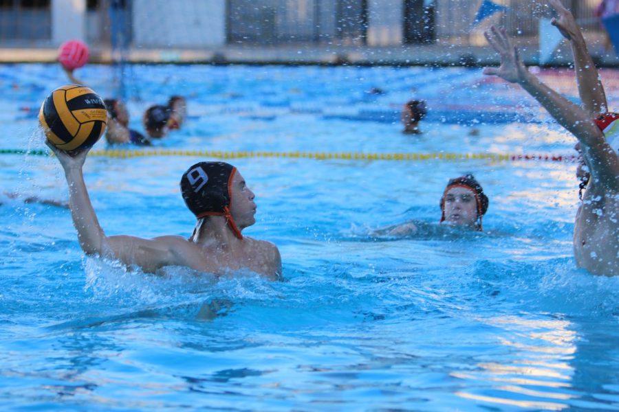 Junior Tyler Stevens (9) gets ready to take a shot against Granada for the mens water polo team.