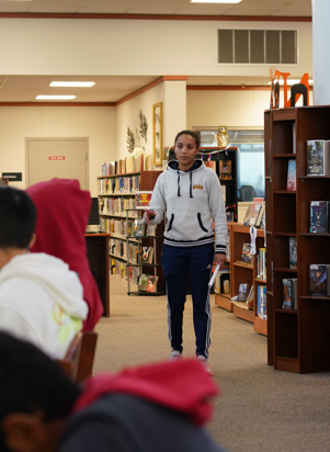 New sports psychologist Maite Reece speaks to members of Cal High’s cross county team during a recent session in the library. Reece, the school’s first sports psychologist, worked with several teams this fall season.