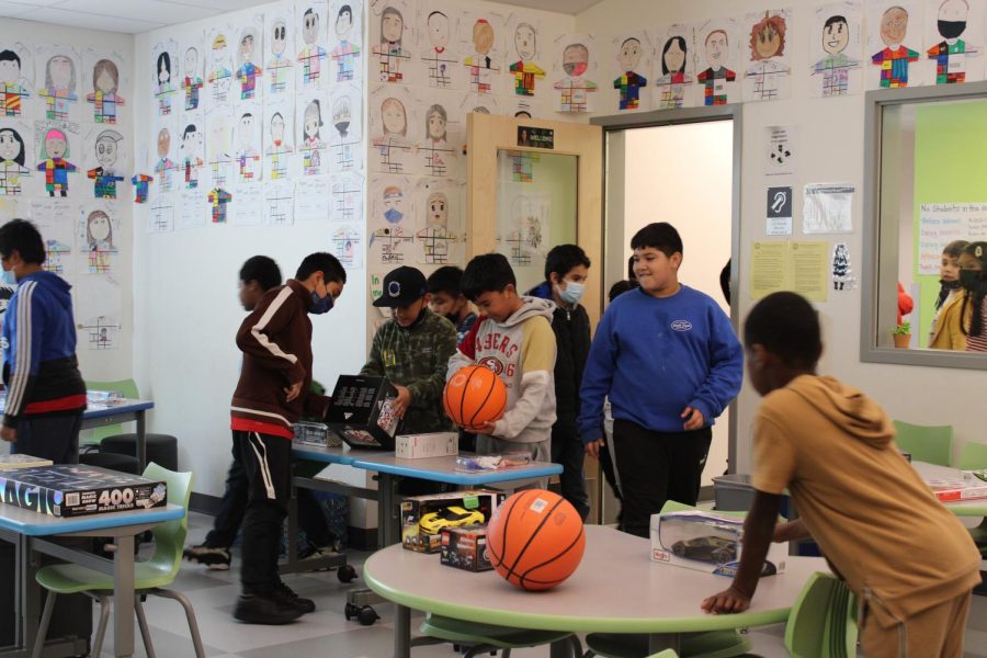 Children from Michelle Obama Elementary walk into a classroom to pick out toys that were donated by students at Cal High. Cal was able to collect more than 400 toys for the children.