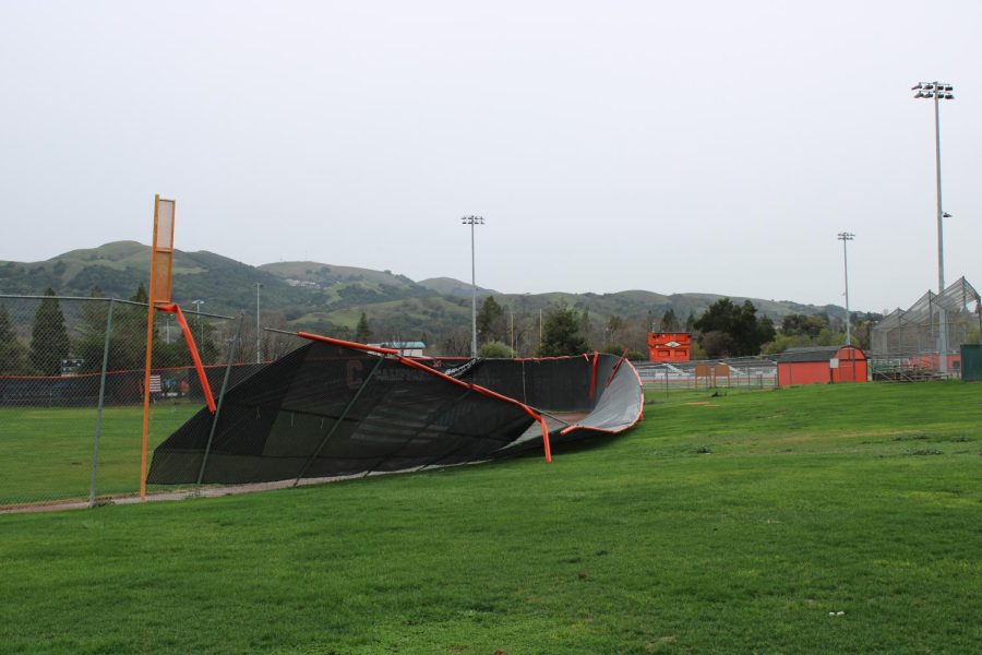 The baseball fence was damaged during winter storms.