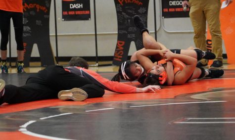 Junior Mia Larson (right) tries to escape her opponent’s grasp duirng Cal High’s senior night.
