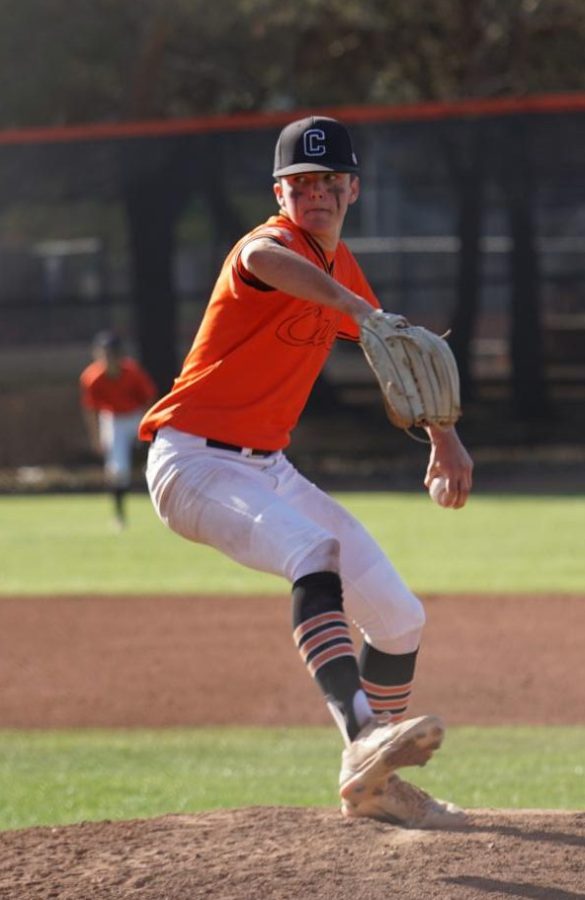 Junior Ben Johnson makes a pitch for the Grizzlies.