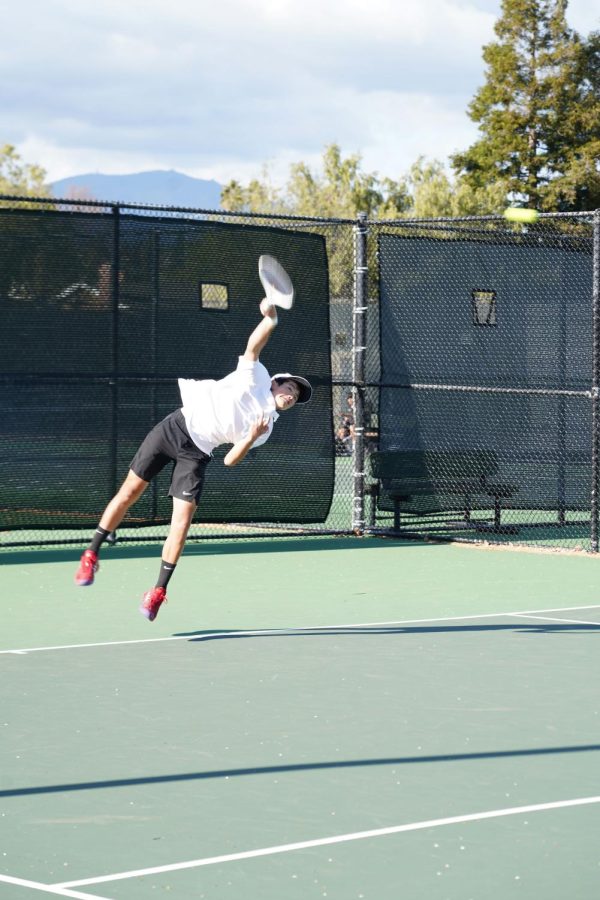 Sophomore Elbert Said delivers a serve during the Grizzlies’ 8-1 win over Dougherty Valley on March 30.