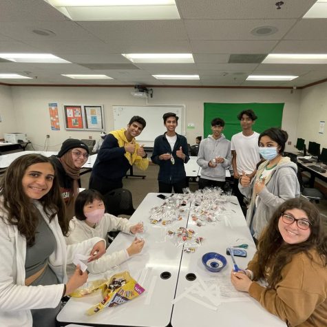 MSA students collaborate to make goodie bags for teachers to inform them on why their students may feel lethargic while fasting during Ramadan.