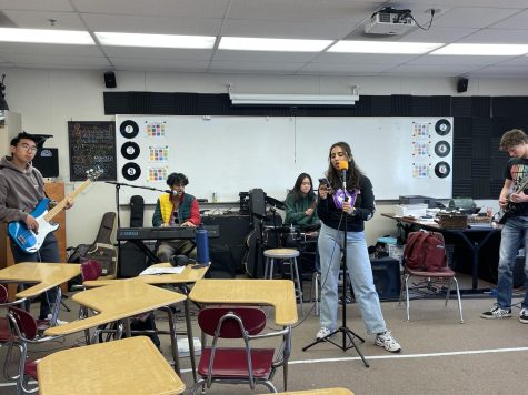 From left to right, seniors Patrick Lee, Sunny Jayaram, Angela Zhang, Saachi Sharma, and Aidan Buck jam out during a practice session in AP Gov teacher Brandon Andrews’ classroom.
