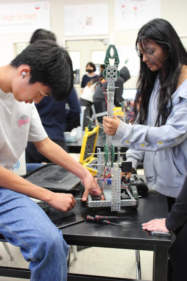 Sophomores Benjamin Seo, left, and Saesha Ray build a robot. The students are part of one of Cal robotics’ several Cubs teams that are being trained to eventually compete.