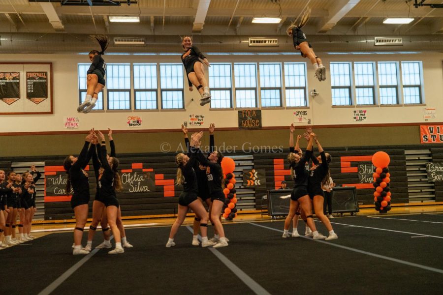 The girls who serve as the bases throw up the flier during their EBAL clinching competition.  Cal’s team went on to win the NCS Championship and finish second in the state, which is the best finish of any sport in the school’s almost 50-year history.