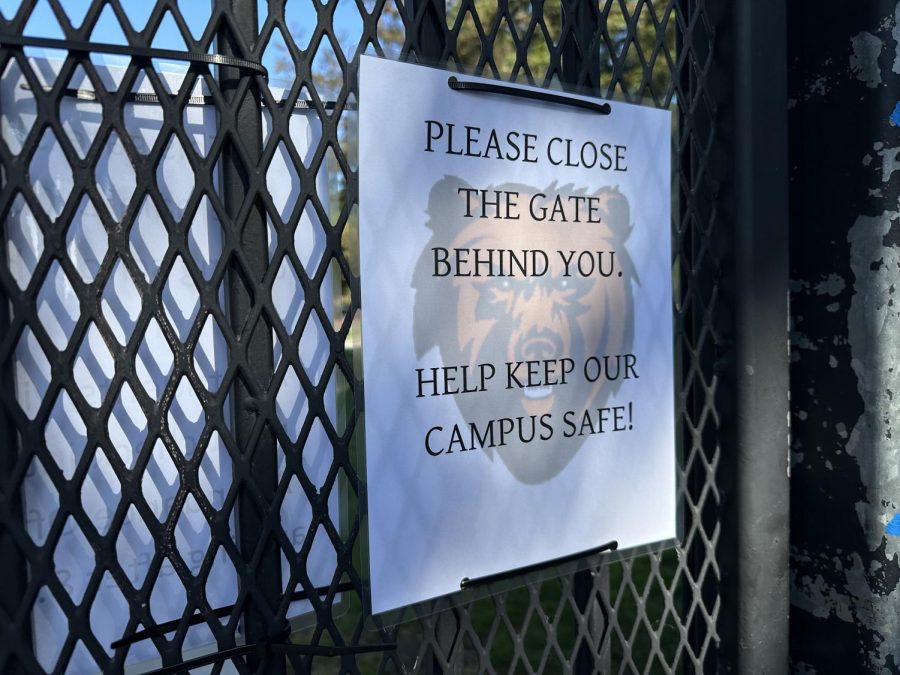 A sign indicating one of the new rules are now in place to improve campus security is now attached to campus gates.