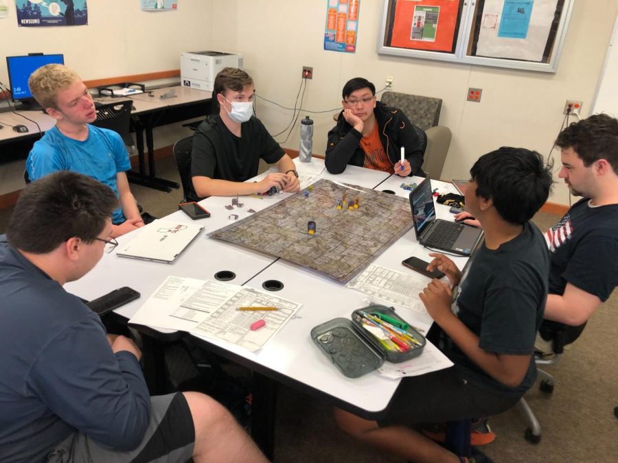Members of Cal Highs Dungeons and Dragons Club play a session in the school library.