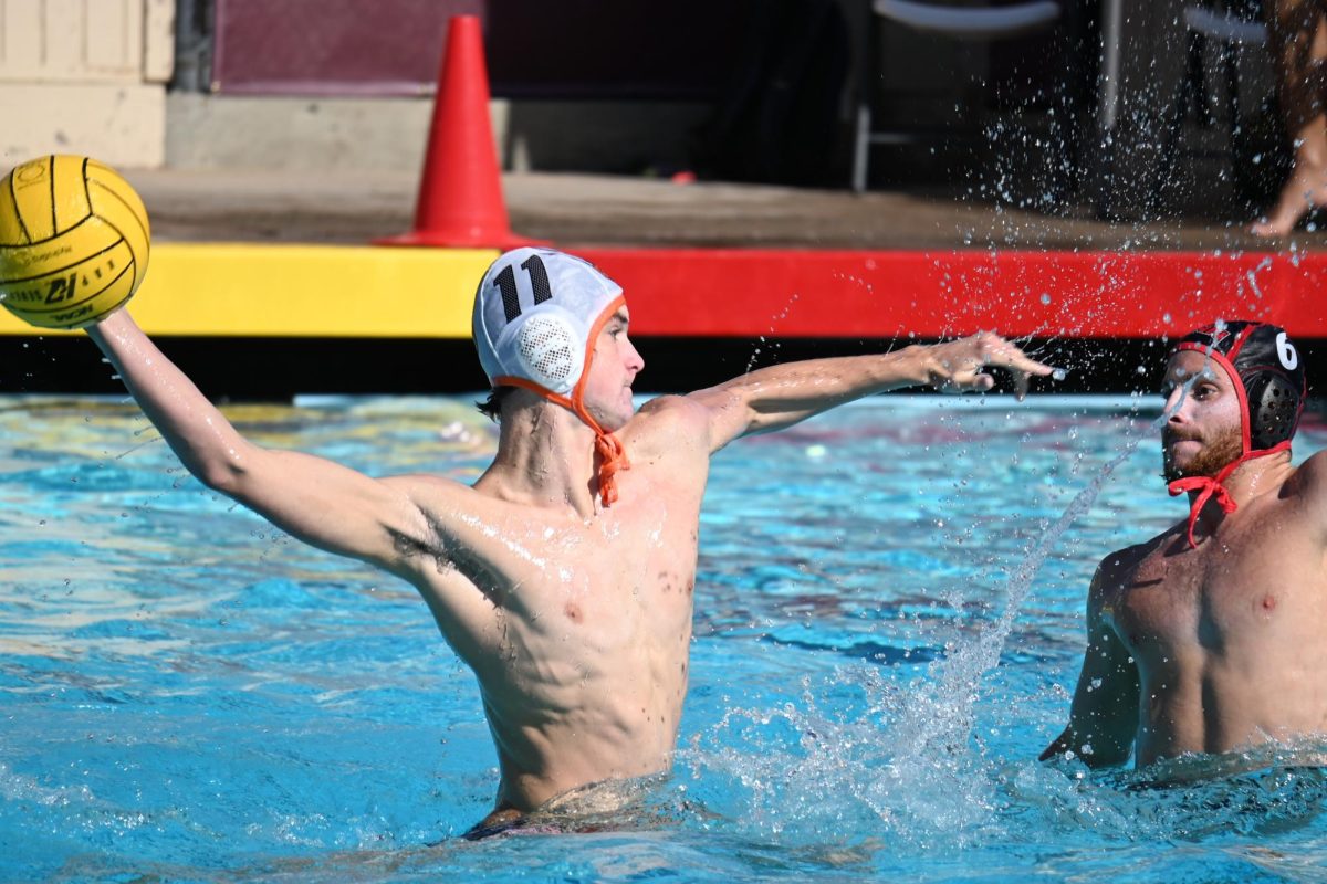 Junior Aiden Berry gets ready to shoot the ball during a tournament game this season. Berry has played with the Grizzlies’ varsity team for three seasons.
