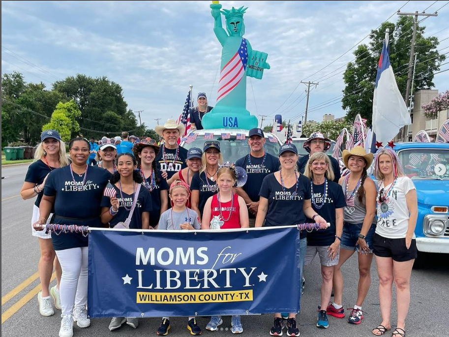 A Moms for Liberty chapter parades through the streets of Williamson County, Texas. A group of parents from the organization recently spoke at a school board meeting.