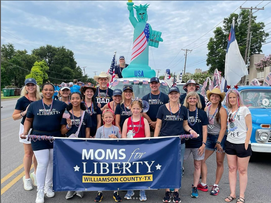 A+Moms+for+Liberty+chapter+parades+through+the+streets+of+Williamson+County%2C+Texas.+A+group+of+parents+from+the+organization+recently+spoke+at+a+school+board+meeting.