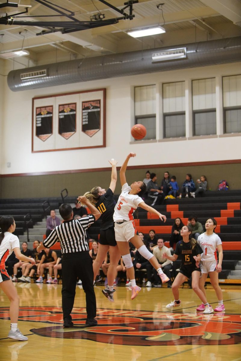 Cal High varsity player junior Taylor Lim (5) wins tipoff against Amador Valley for the women’s team.  