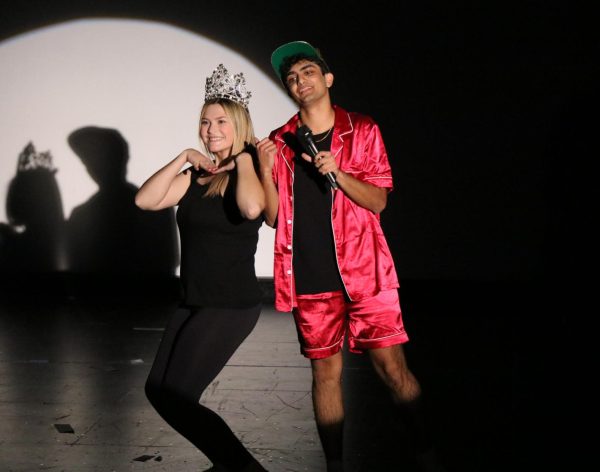 Seniors Madison Mittone, left, and Sachit Ganotra, acting as Bruno Mars, perform “Billionare” during the competition. 