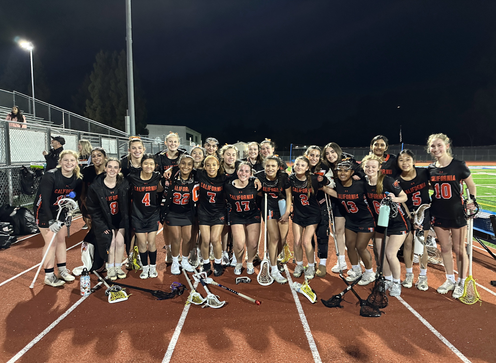 Cal High’s women’s lacrosse team poses at Acalanes high in Lafayette after beating the Dons 15-9 on Feb. 23. The team is 4-2 under the leadership of new coach Tom Perry and his daugter, Madison Perry. 