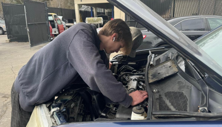 San Ramon Valley High School senior Jake Sellar uses an angle grinder on a piece of steel while working in the schools auto shop class. Cal High had a similar class until 2006.