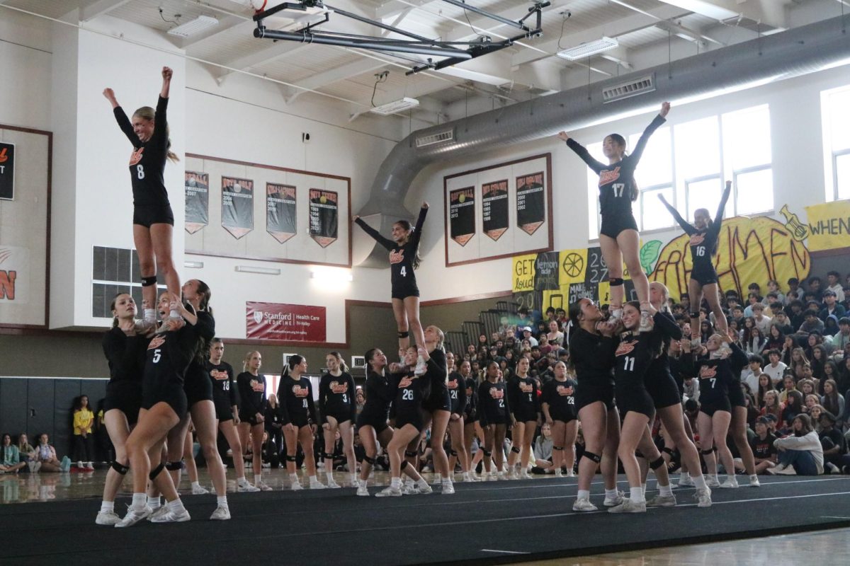 Above, sophomore Jadyn-Taylor Vo tries to balance with the help of her teammates as Cal High’s stunt team preforms at a school rally on April 26. The team won its second straight NCS title on April 27 by beating Liberty High 18-11.