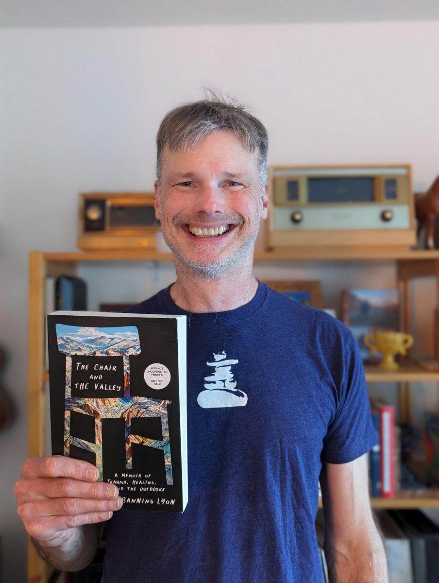 Banning Lyon holds his new book,  “The Chair and The Valley,” which is about his experiences with  PTSD. He is English teacher Regina Lyon's husband. 
