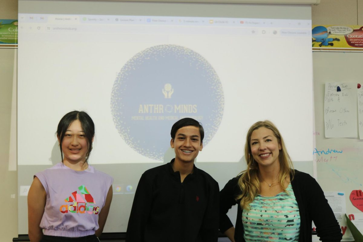 From left to right, sophomores Cindy Li and Arjun Patel pose with Positive Psychology teacher Christina Haaverson before leading a meeting for Anthrominds, a new Cal club.