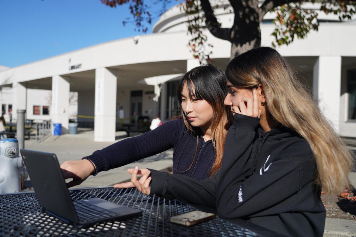 CHAP secretary Melissa Nguyen, left, and president senior Siena Dhillon raise money for sick children.