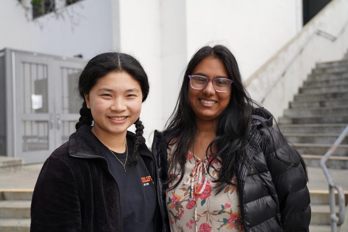 Seniors Fiona Xie, left, and Ipshita Aggarwal helped Banning Lyon with marketing his book as iQuest interns this year. Banning Lyon, who is the husband of English teacher Regina Lyon, is publishing "The Chair and The Valley" on June 4. 
