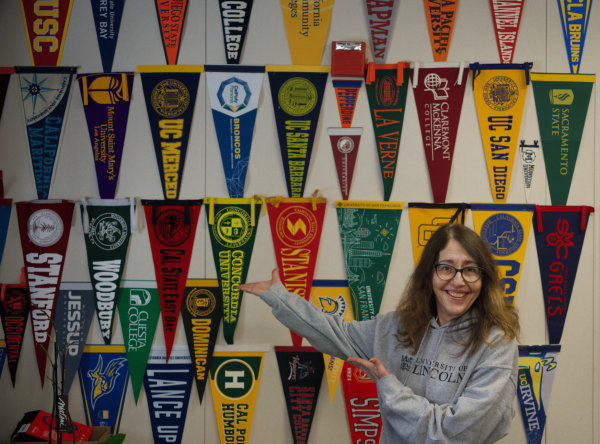 Kathryn Nichols displays many college banners she has collected through her years as Cal’s career counselor. She said pre-college programs are promoted to help prepare students.