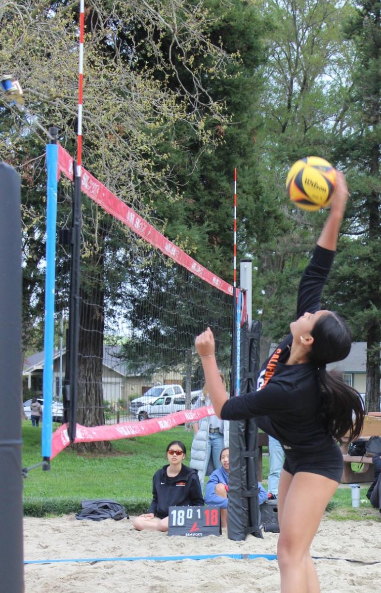 Beach volleyball player Sofia Bonifacio spikes the ball over the net during a beach volleyball game against Monte Vista on March 27.  