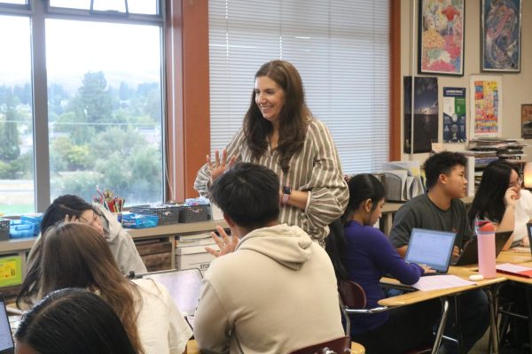 English teacher Ginger Clark teaches her AP Literature students during their group work.
