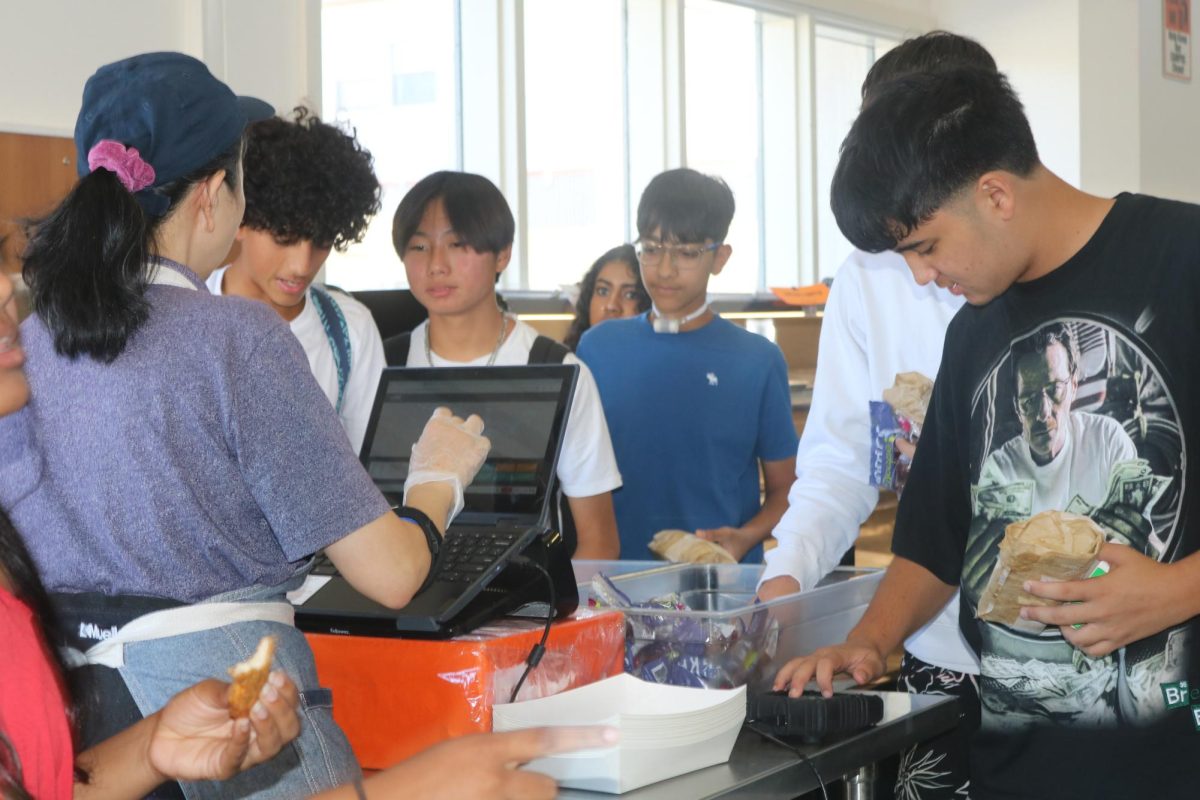 From left to right, freshmen John Khalil, Jaeyoung Jung, Saransh Kumar and Joaquin Ruiz line up in the cafeteria to get their lunches. The line in the cafeteria is often long and crowded, leaving students waiting in the back with almost no food left. 