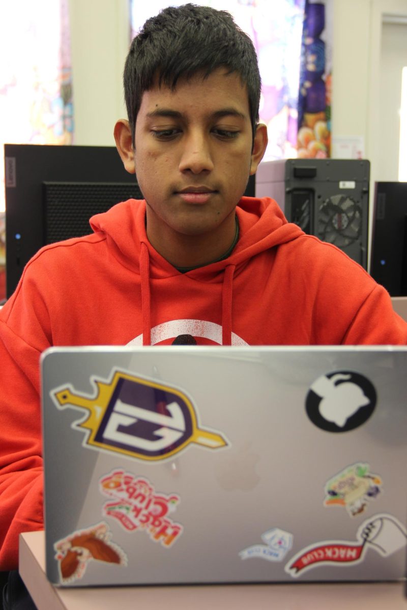 Junior Shreyan Mitra works on a presentation with the help of Clubly, which is a student-created tool that helps Cal High clubs stay better organized.