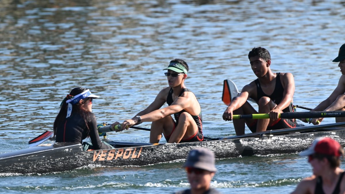 Senior Toby Ding, center, powers through an intense rowing competition. Ding participated in activities like rowing and life guarding which fueled his interest in naval architecture.