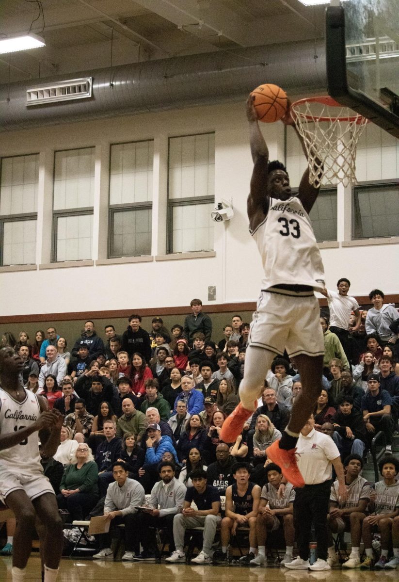 Senior center Juremi Ejuwa soars to the rim for a two-handed dunk on a fast break during Cal High's 70-65 win over the Dublin Gaels on Jan. 9. 