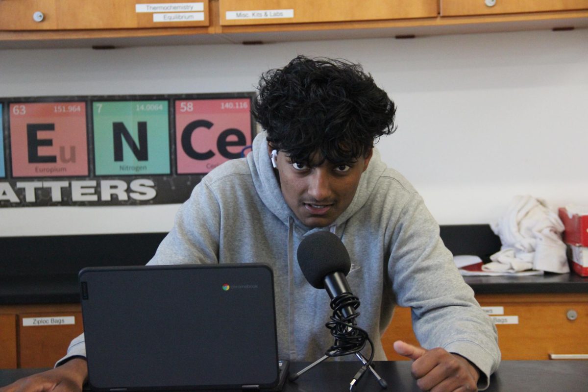 Sophomore Rayal Nadan poses in front of his recording equipment in Ryan Hughes’ chemistry classroom. Nadan, known as Rdeezy, aspires to rap like NBA YoungBoy.