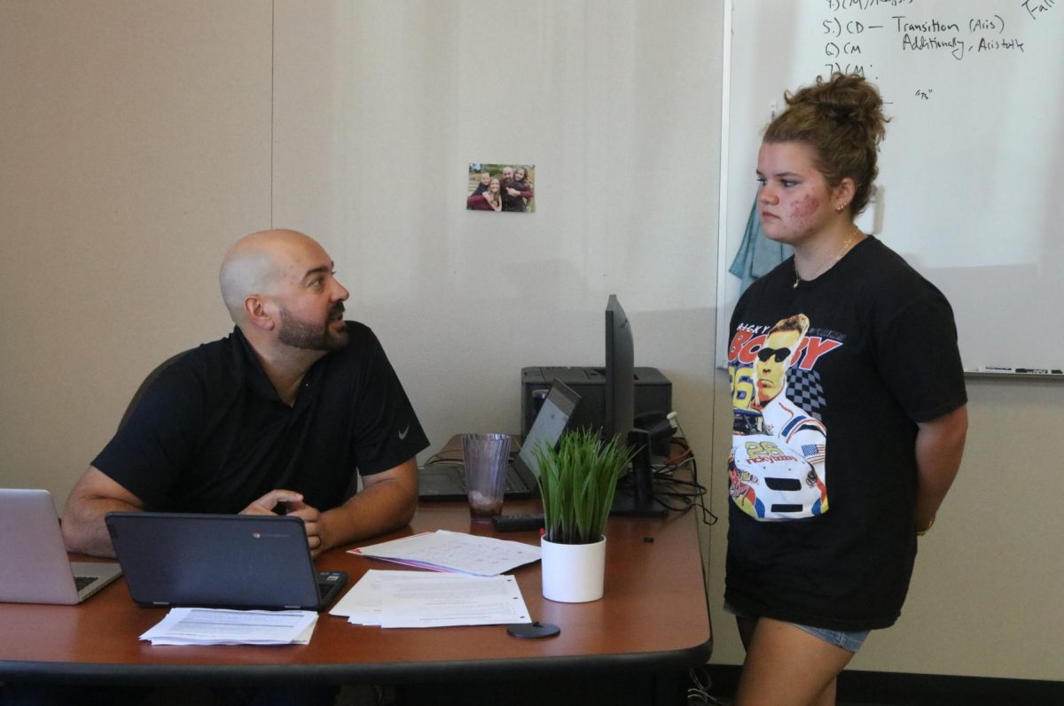 World History and ethnic studies teacher Justin Santich-Hughes speaks with freshman Natasha Novosel. Hughes also coaches baseball at San Ramon Valley High.
