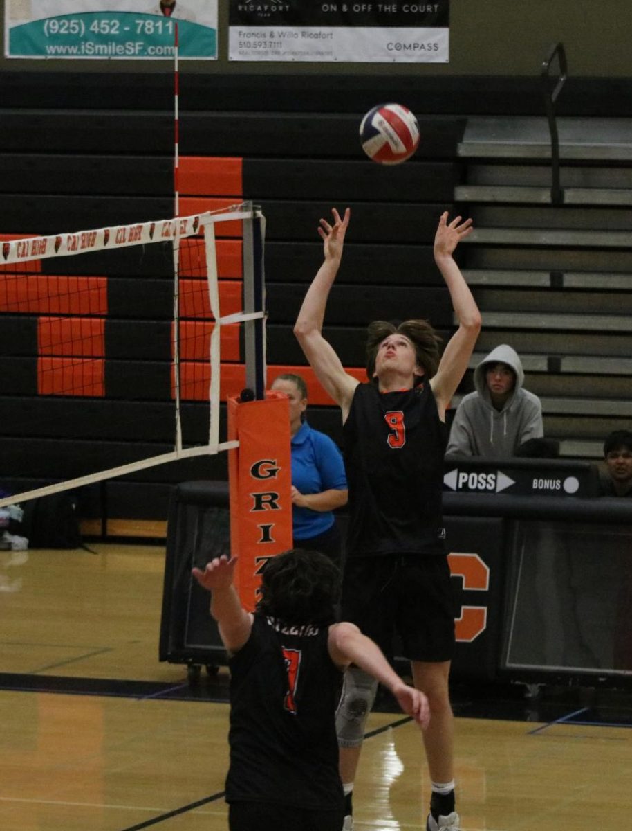 Junior Beau Banta, a varsity setter, sets the ball in the air for senior Gabriel Buehler-Robert to spike it. The volleyball team is among the sports that’s off to an amazing start this season.