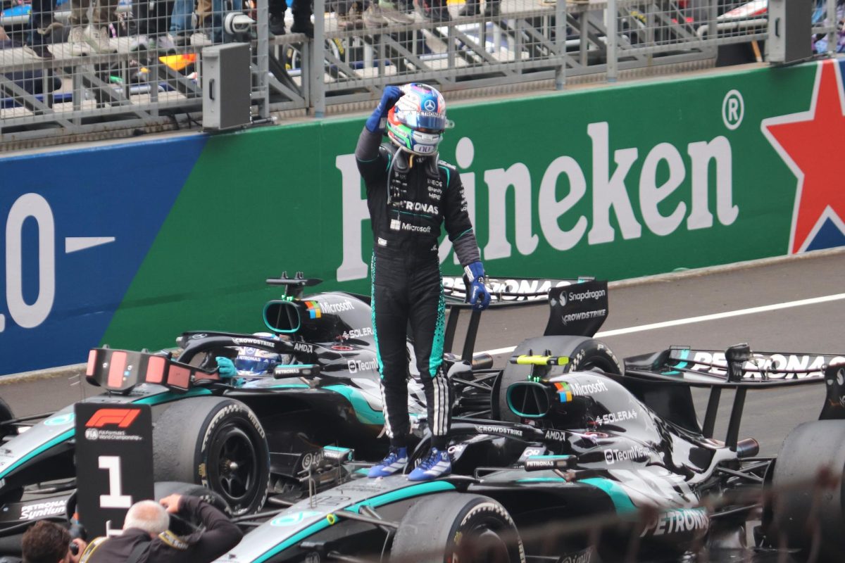 Kimi Antonelli stands on top of his car after his first Formula One win at the Chinese Grand Prix. Since then, he has gone on to win three more.