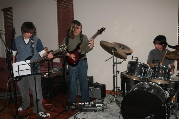 From left to right, Death of Creation members senior bassist Lee Mau, senior guitarist and vocalist Dmitrii Morov, and senior drummer Elias Du practice in Morov’s garage. The band consisting of four seniors formed last semester.