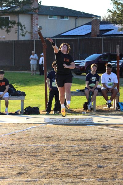 Senior captain Magnus Carlson launches the shot put during the Mirawest dual track meet. 